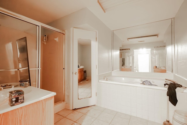 bathroom with tile patterned flooring, vanity, and independent shower and bath