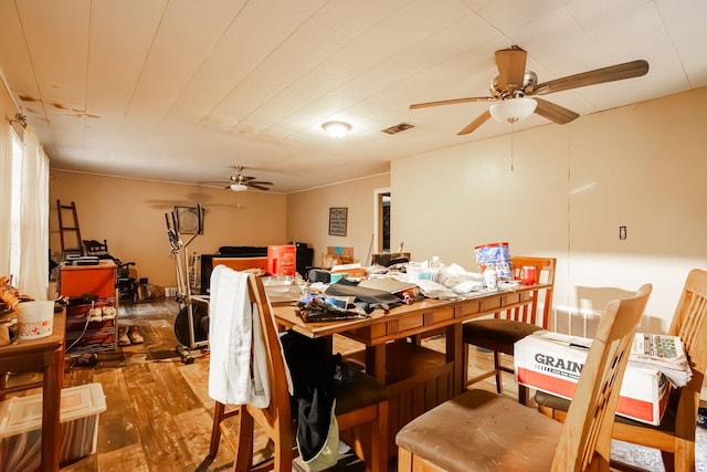 dining room with ceiling fan and wood-type flooring