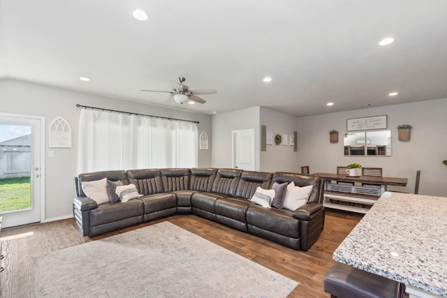 living room featuring recessed lighting, a ceiling fan, and wood finished floors