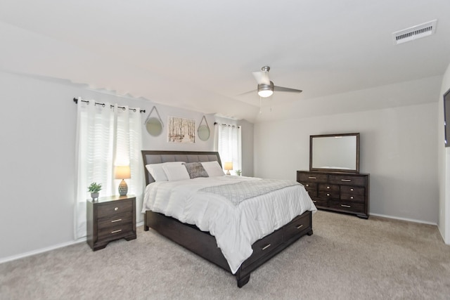 bedroom with ceiling fan, baseboards, visible vents, and light carpet