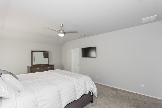 bedroom featuring carpet flooring, baseboards, lofted ceiling, and visible vents