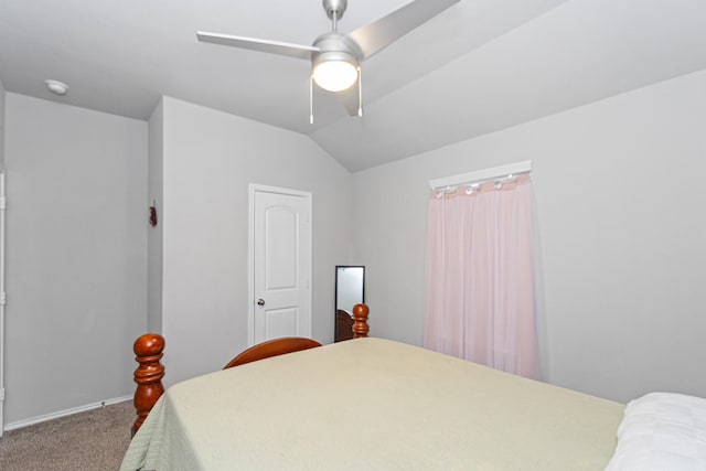 bedroom featuring ceiling fan, baseboards, carpet, and vaulted ceiling