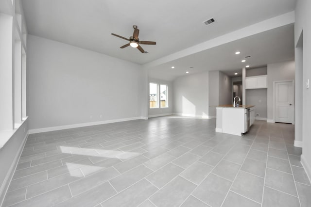 unfurnished living room featuring baseboards, recessed lighting, visible vents, and a ceiling fan