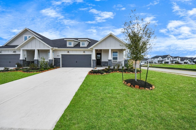 craftsman house with stone siding, a porch, board and batten siding, and a front yard