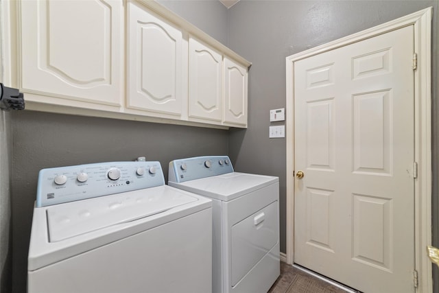 laundry area with cabinets and washing machine and dryer