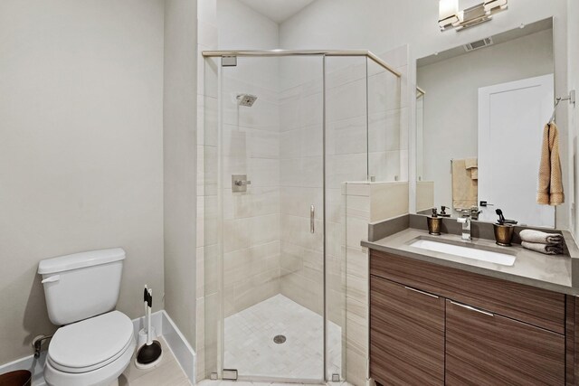 bathroom featuring walk in shower, vanity, and toilet