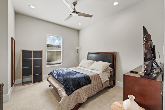 bedroom featuring ceiling fan and light colored carpet