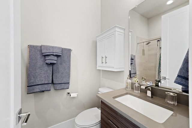 bathroom featuring vanity, a shower with curtain, and toilet