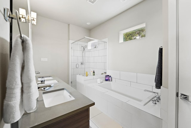 bathroom featuring vanity and plus walk in shower