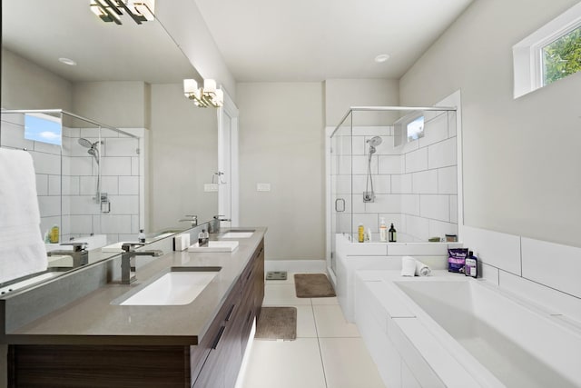 bathroom featuring plus walk in shower, vanity, and tile patterned floors