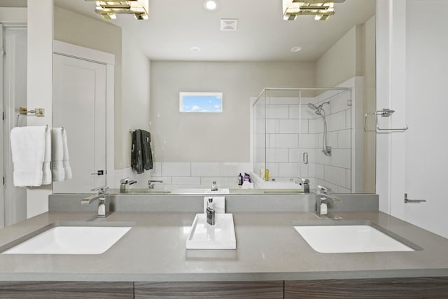 bathroom featuring vanity and an enclosed shower