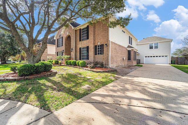 view of front of property featuring a garage and a front yard