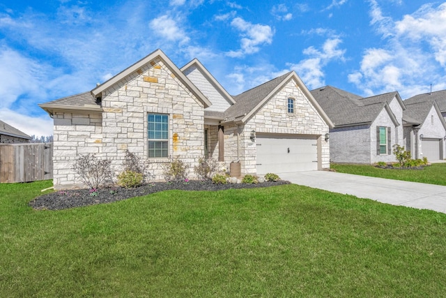 view of front of property featuring a front lawn and a garage