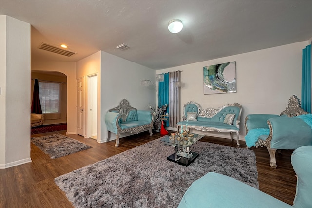 living room featuring dark hardwood / wood-style flooring