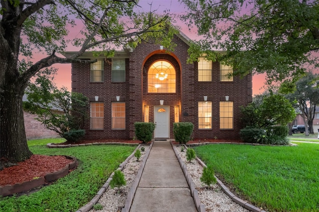 view of front of property with a yard