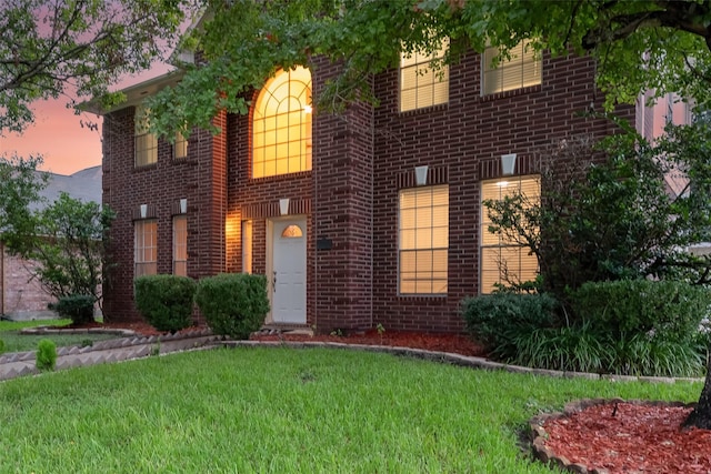 view of front of home with a yard