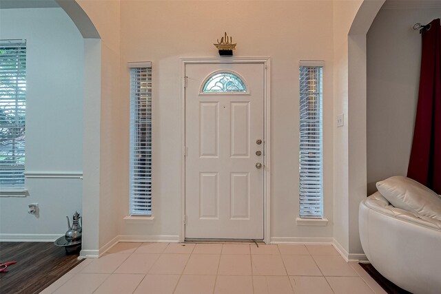 entrance foyer with light tile patterned floors