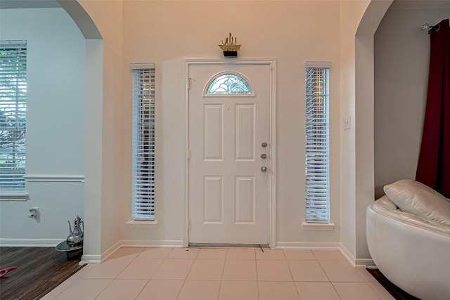 entryway featuring light tile patterned floors