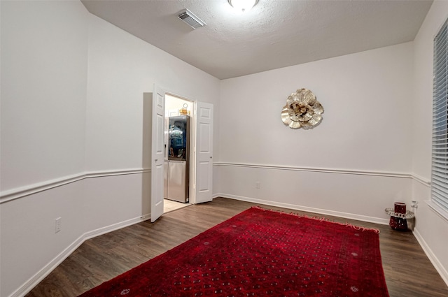 empty room featuring dark hardwood / wood-style floors