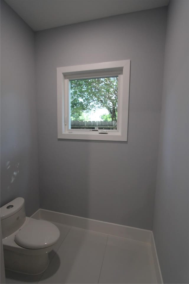 bathroom featuring tile patterned floors and toilet