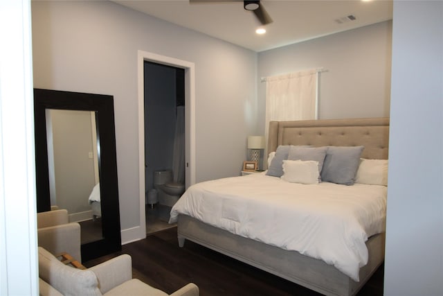 bedroom featuring connected bathroom, ceiling fan, and dark wood-type flooring