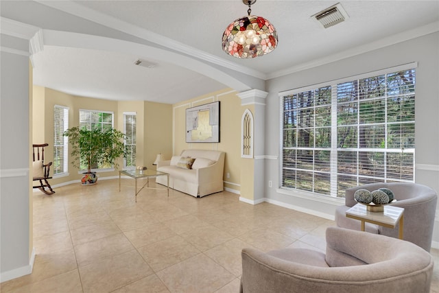 living area with light tile patterned flooring and ornamental molding