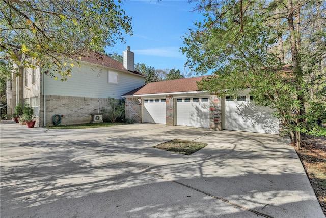 view of side of property with a garage