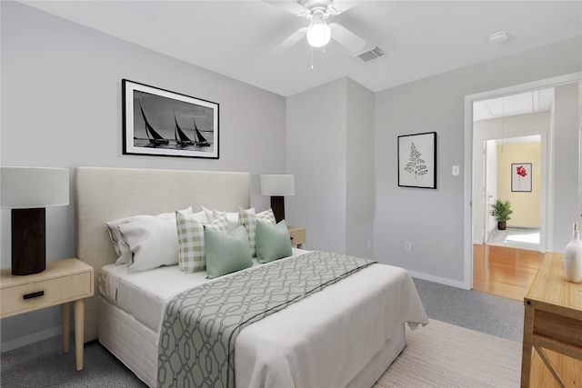 carpeted bedroom featuring ceiling fan