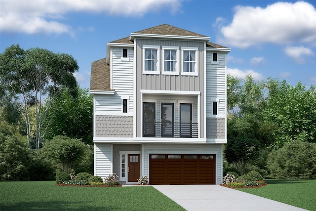 view of front of home with a front lawn and a garage