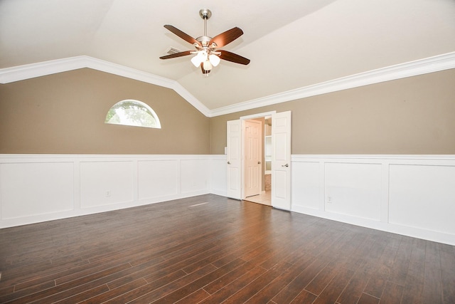 unfurnished room with dark hardwood / wood-style floors, ceiling fan, ornamental molding, and vaulted ceiling