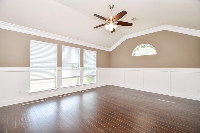 empty room featuring ornamental molding, dark hardwood / wood-style flooring, ceiling fan, and lofted ceiling