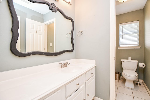 bathroom featuring toilet, vanity, and tile patterned floors