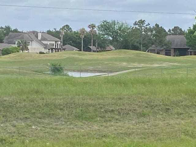 view of home's community with a lawn