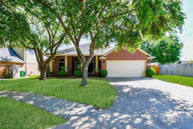 view of front of home featuring a front lawn and a garage