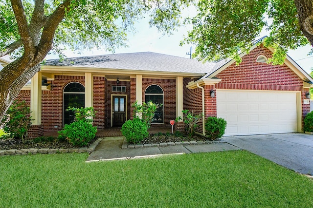 ranch-style house featuring a front yard and a garage