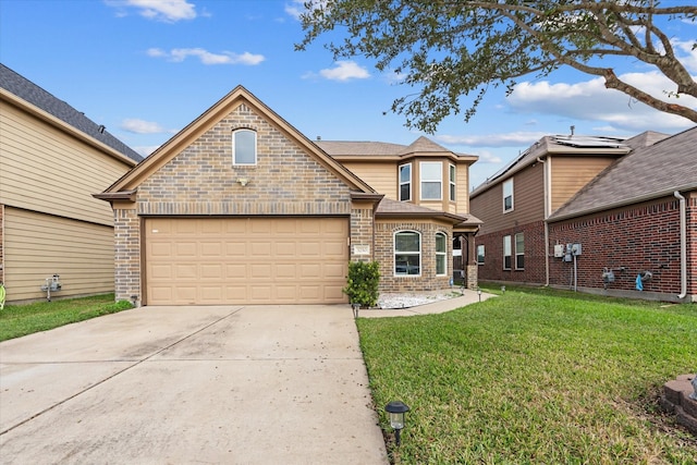 view of front of home with a front yard and a garage