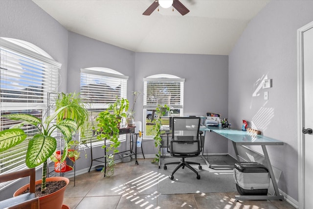 office area featuring ceiling fan, tile patterned flooring, and vaulted ceiling