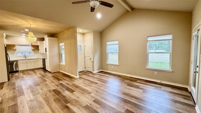 kitchen featuring dishwasher, light hardwood / wood-style floors, pendant lighting, white cabinetry, and ceiling fan with notable chandelier