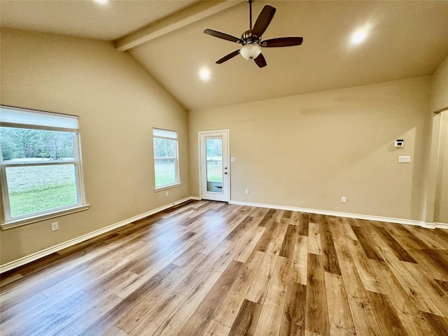 unfurnished room with light hardwood / wood-style floors, ceiling fan, beamed ceiling, and a healthy amount of sunlight