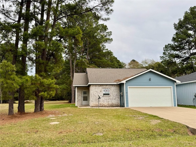 view of front of property with a garage and a front yard