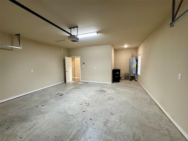 garage featuring water heater and a garage door opener