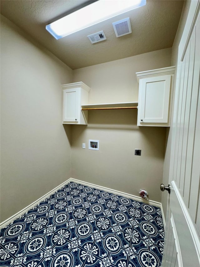 laundry area featuring cabinets, washer hookup, and hookup for an electric dryer