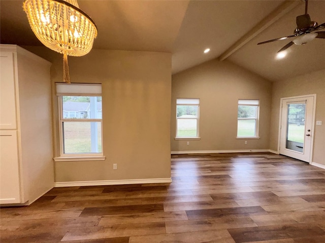 interior space with ceiling fan with notable chandelier, dark hardwood / wood-style floors, and lofted ceiling with beams