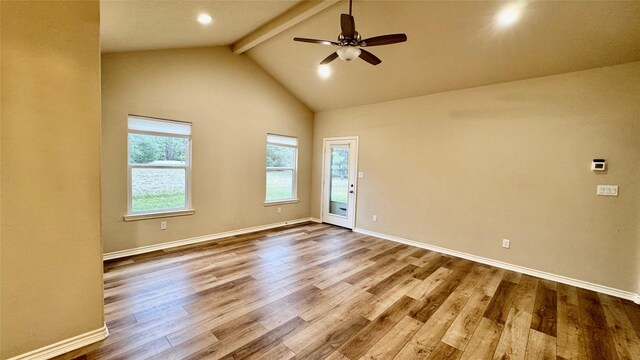 spare room with high vaulted ceiling, ceiling fan, wood-type flooring, and beamed ceiling