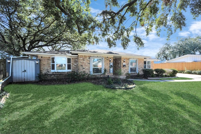 ranch-style house with a front lawn