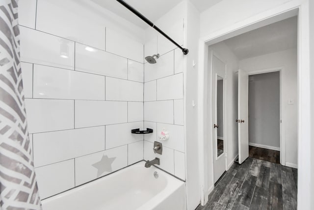 bathroom with shower / bath combo with shower curtain and hardwood / wood-style floors