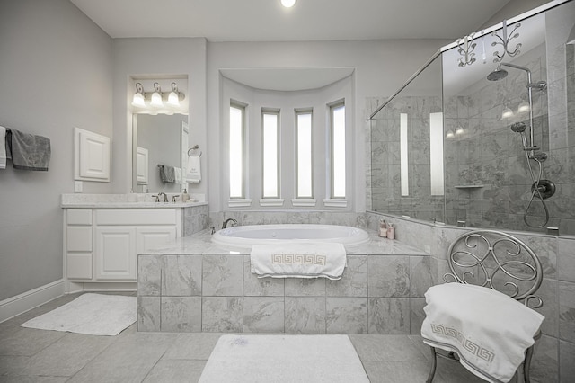 bathroom featuring tile patterned flooring, vanity, and separate shower and tub