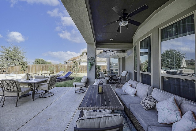 view of patio with ceiling fan and an outdoor living space