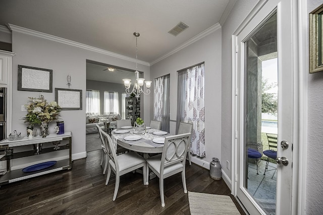 dining space with dark hardwood / wood-style flooring, crown molding, and a notable chandelier