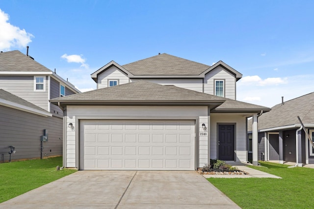 traditional-style home with a garage, concrete driveway, roof with shingles, and a front lawn